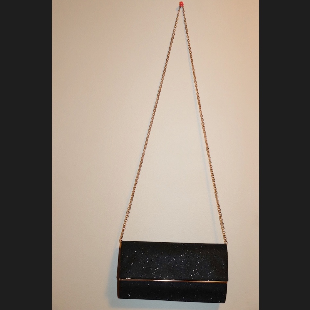 Black purse with gold chain